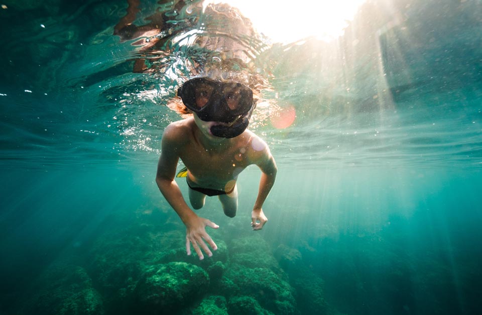 young boy snorkeling